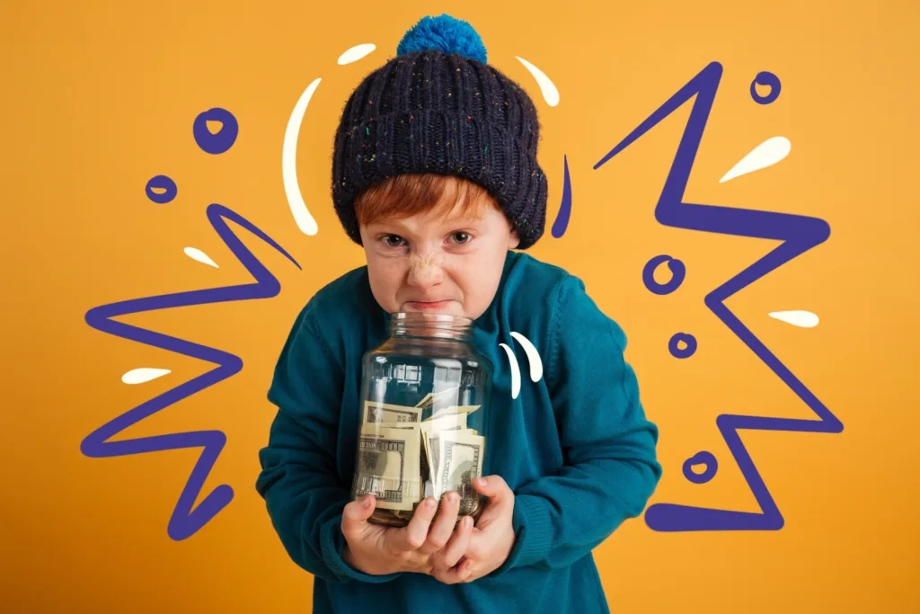 Дитина кладе гроші у скарбничку – навчання фінансової грамотності.