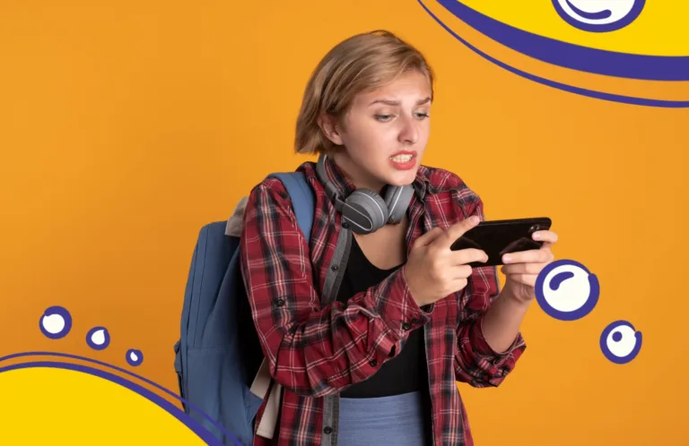 Підліток відволікається на телефон під час навчання